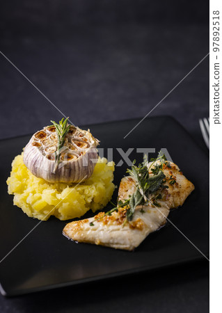 cod fillet with couscous and roasted garlic 97892518