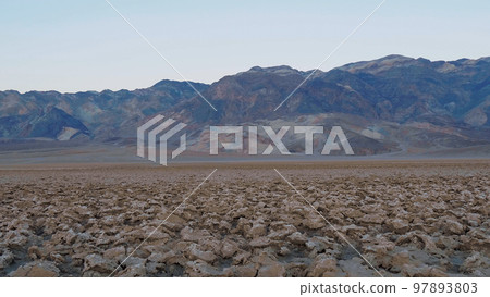 The crusty landscape of Devils Golf Course at Death Valley National Park The crusty landscape of Devils Golf Course at Death Valley National Park 97893803