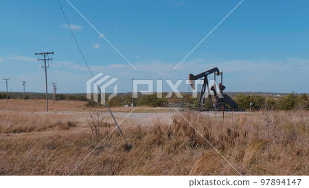 Oil pump in the countryside of Oklahoma - Pump jack Oil pump in the countryside of Oklahoma - Pump jack 97894147