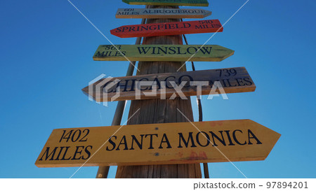 Direction signs to famous cities at Route 66 97894201