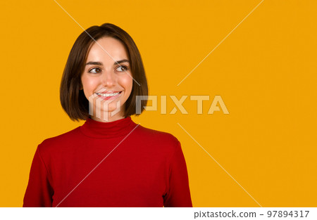 Headshot of curious cute brunette woman looking at copy space 97894317