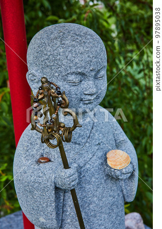 Detail of stone statue figure at Tibetan Mongolian Buddhist shrine 97895038