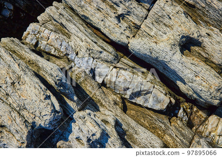 Detail of rocks from above with large section of mineral quartz vein Detail of rocks from above with large section of mineral quartz vein 97895066