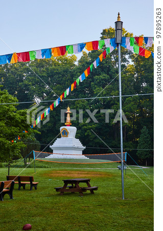 Chorten monument with prayer flags in forest of Tibetan Mongolian Buddhist cultural center Chorten monument with prayer flags in forest of Tibetan Mongolian Buddhist cultural center 97895263