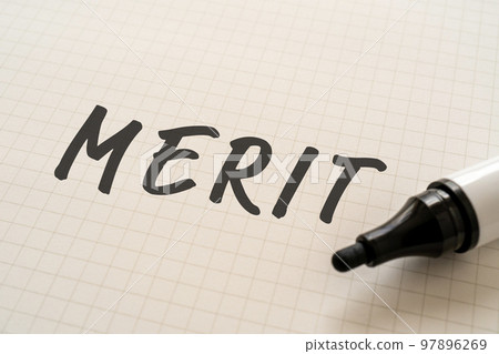 A notebook and marker written MERIT 97896269