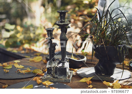 The vintage candles with dripping paraffin in autumn 97896677