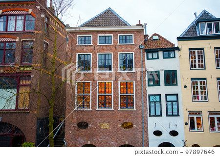 Street along the canal near old houses. Utrecht, Netherlands Street along the canal near old houses. Utrecht, Netherlands 97897646