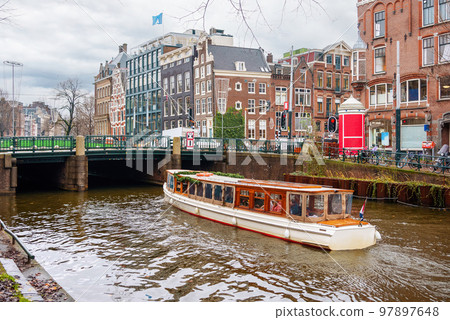 Channel in Amsterdam Netherlands houses river Amstel landmark old european city landscape Channel in Amsterdam Netherlands houses river Amstel landmark old european city landscape 97897648