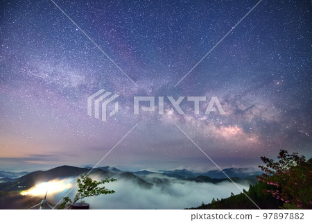 Sea of clouds and spring galaxy 97897882
