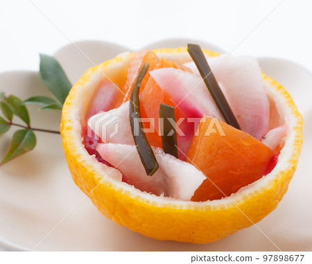 Namasu with persimmons and turnips in vinegar Namasu with persimmons and turnips in vinegar 97898677