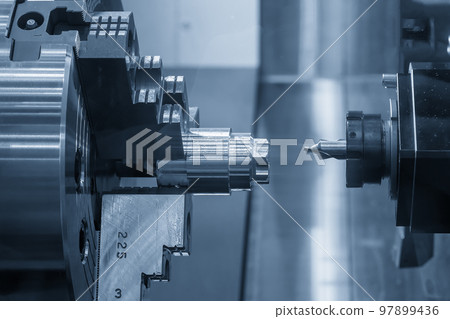 The multi-tasking CNC lathe machine chamfer cutting the metal shaft parts by milling turret. The multi-tasking CNC lathe machine chamfer cutting the metal shaft parts by milling turret. 97899436