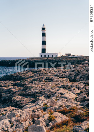 Beautiful blue white lighthouse on the Spanish island of Menorca 97899524