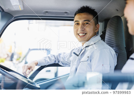 Delivery staff driving a truck Delivery staff driving a truck 97899983