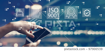 ISO 9001 concept with person using smartphone 97900539