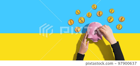 Person depositing money in a piggy bank 97900637