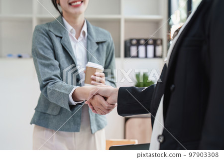 Business people handshake with business partners. Successful business concept. shaking hand after deal concept Business people handshake with business partners. Successful business concept. shaking hand after deal concept 97903308