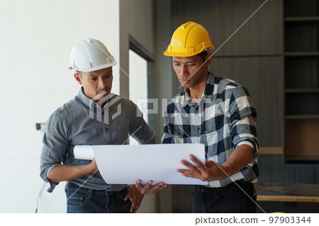 Professional architect designer structural engineer team colleagues discussing building plan design project 97903344