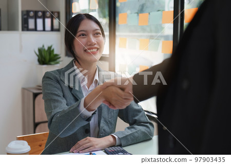 Business people handshake with business partners. Successful business concept. shaking hand after deal concept 97903435