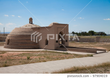 An old stone building for storing water on the road to Bukhara, in Uzbekistan. 97904019