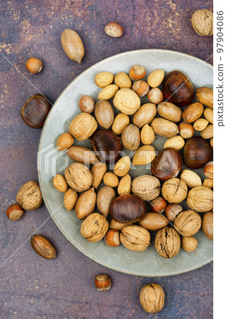 Mixed nuts on the table 97904086