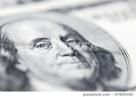 The face of Benjamin Franklin on the hundred dollar banknote, backgrounds 97904300