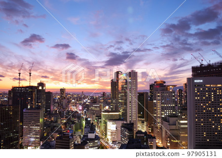 Glittering city lights from dusk 97905131