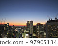 Glittering city lights from dusk 97905134