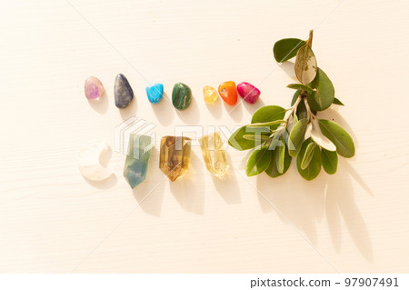 Healing crystals on brown background 97907491
