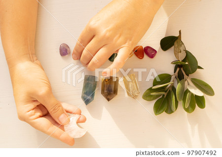 Healing crystals on brown background Healing crystals on brown background 97907492