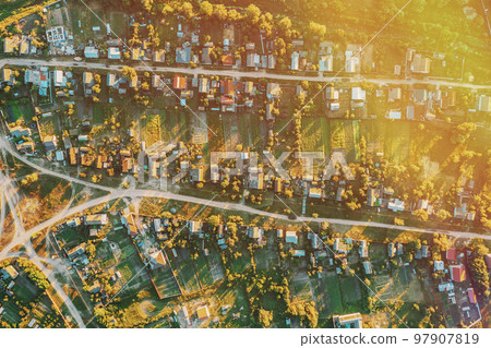 Daytime. Residential Houses. Small European City. Aerial View Of Town Village Cityscape Skyline In Summer Sunny Morning. Residential Areas Daytime. Residential Houses. Small European City. Aerial View Of Town Village Cityscape Skyline In Summer Sunny Morning. Residential Areas 97907819