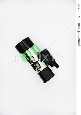 Cigarette lighter with green backlight. Spare part for the car. The electric cigarette lighter is disassembled. 97908356