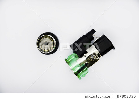 Cigarette lighter with green backlight. Spare part for the car. The electric cigarette lighter is disassembled. 97908359