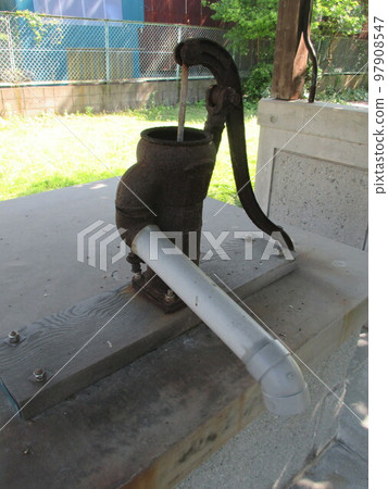 An old hand-pumped well pump in the backyard of the former Takada Kaisoten, a historic Kaiso wholesaler in Misumi Nishiko, a world heritage site in Uki City, Kumamoto Prefecture. An old hand-pumped well pump in the backyard of the former Takada Kaisoten, a historic Kaiso wholesaler in Misumi Nishiko, a world heritage site in Uki City, Kumamoto Prefecture. 97908547