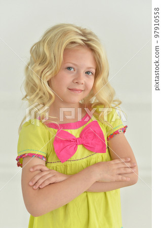 girl posing standing in a white studio girl posing standing in a white studio 97910558