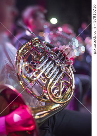 musician playing the horn musician playing the horn 97910710