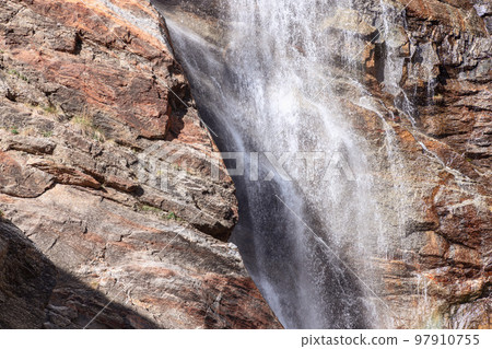 High-contrast, bright close shot of churning water of Lillaz waterfall (Cascate di Lillaz) 97910755