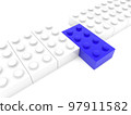 A row of white toy bricks with a blue brick in the middle 97911582