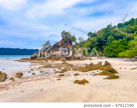 Koh Phayam beach Hin Talu with rock arch formation in Ranong, Thailand. Koh Phayam beach Hin Talu with rock arch formation in Ranong, Thailand. 97912190