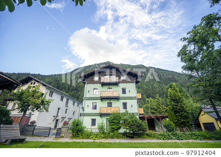 Small Austrian cottage with large mountains 97912404