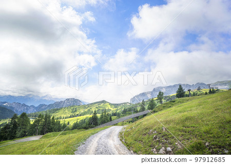 Dirt road in a mountain landscape Dirt road in a mountain landscape 97912685