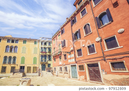 Street in Venice Italy with colorful weathered buildings 97912809