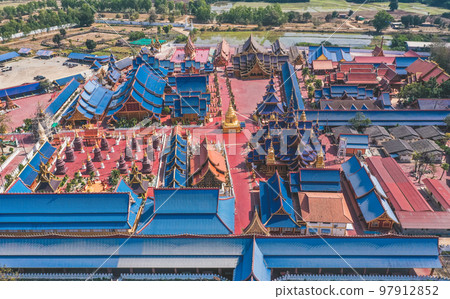 Aerial view of Wat Phiphat Mongkhon blue temple in Sukhothai, Thailand 97912852