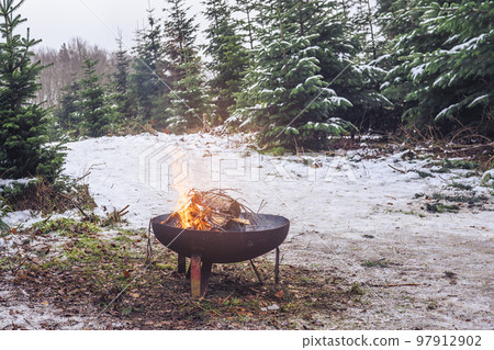 Bonfire with fire wood in the winter 97912902