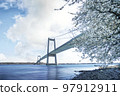 Beautiful bridge over calm waters in the springtime Beautiful bridge over calm waters in the springtime 97912911