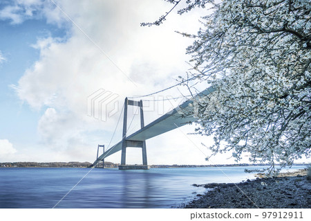 Beautiful bridge over calm waters in the springtime Beautiful bridge over calm waters in the springtime 97912911
