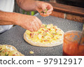 Baker man making a tasty pizza Baker man making a tasty pizza 97912917