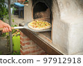 Homemade pizza on a shovel Homemade pizza on a shovel 97912918