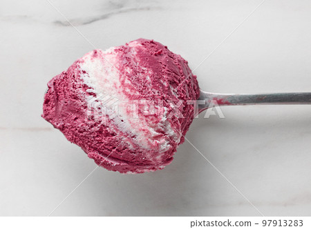 ice cream in a spoon 97913283