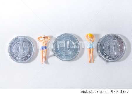 A couple lying down sandwiched between three 1-yen coins A couple lying down sandwiched between three 1-yen coins 97913552