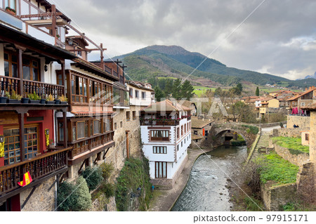 Urban scene of the Cantabrian town of Potes, in the Picos de Europa National Park Urban scene of the Cantabrian town of Potes, in the Picos de Europa National Park 97915171